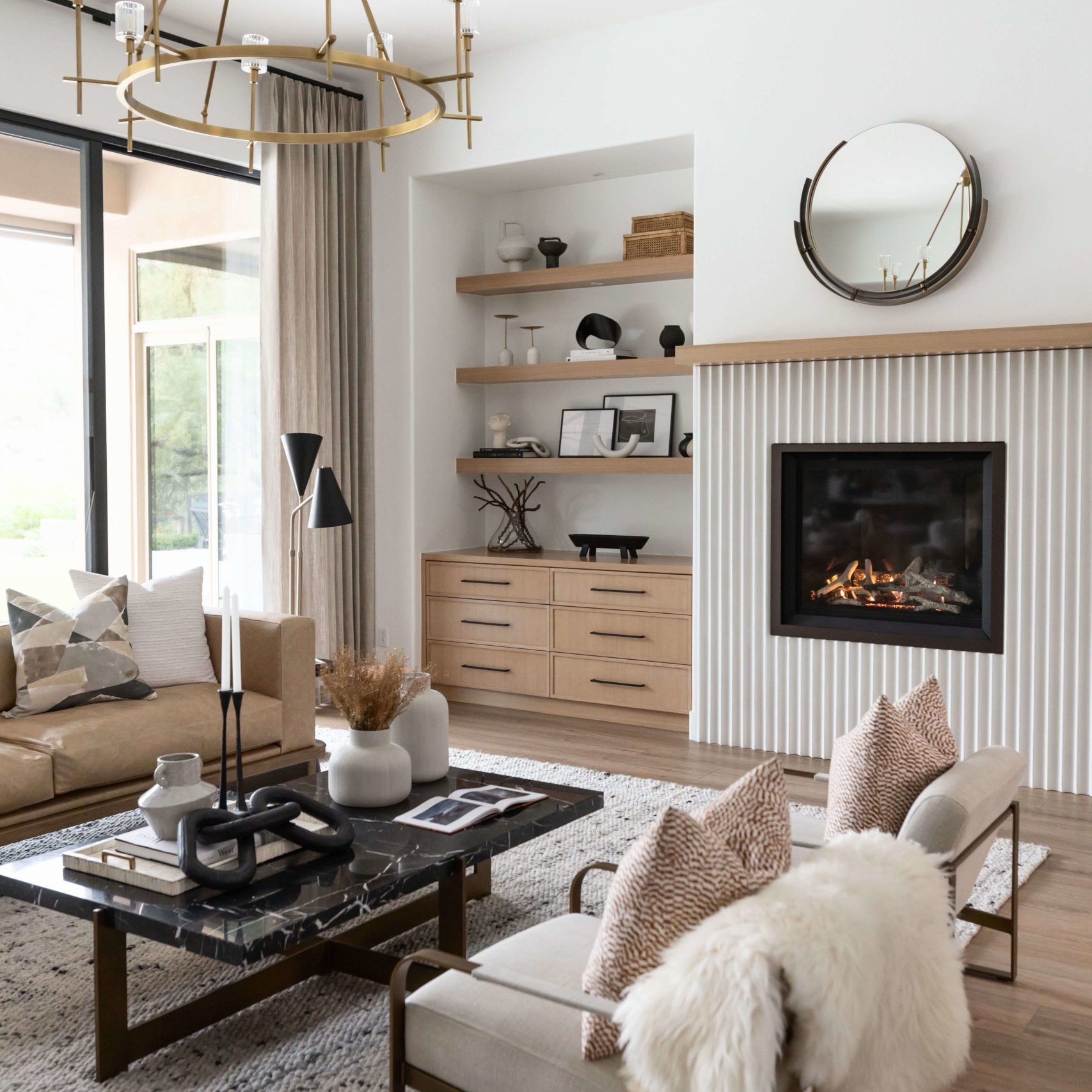 Neutral-toned living space with cozy fireplace Modern living room with fireplace and open shelving in scottsdale