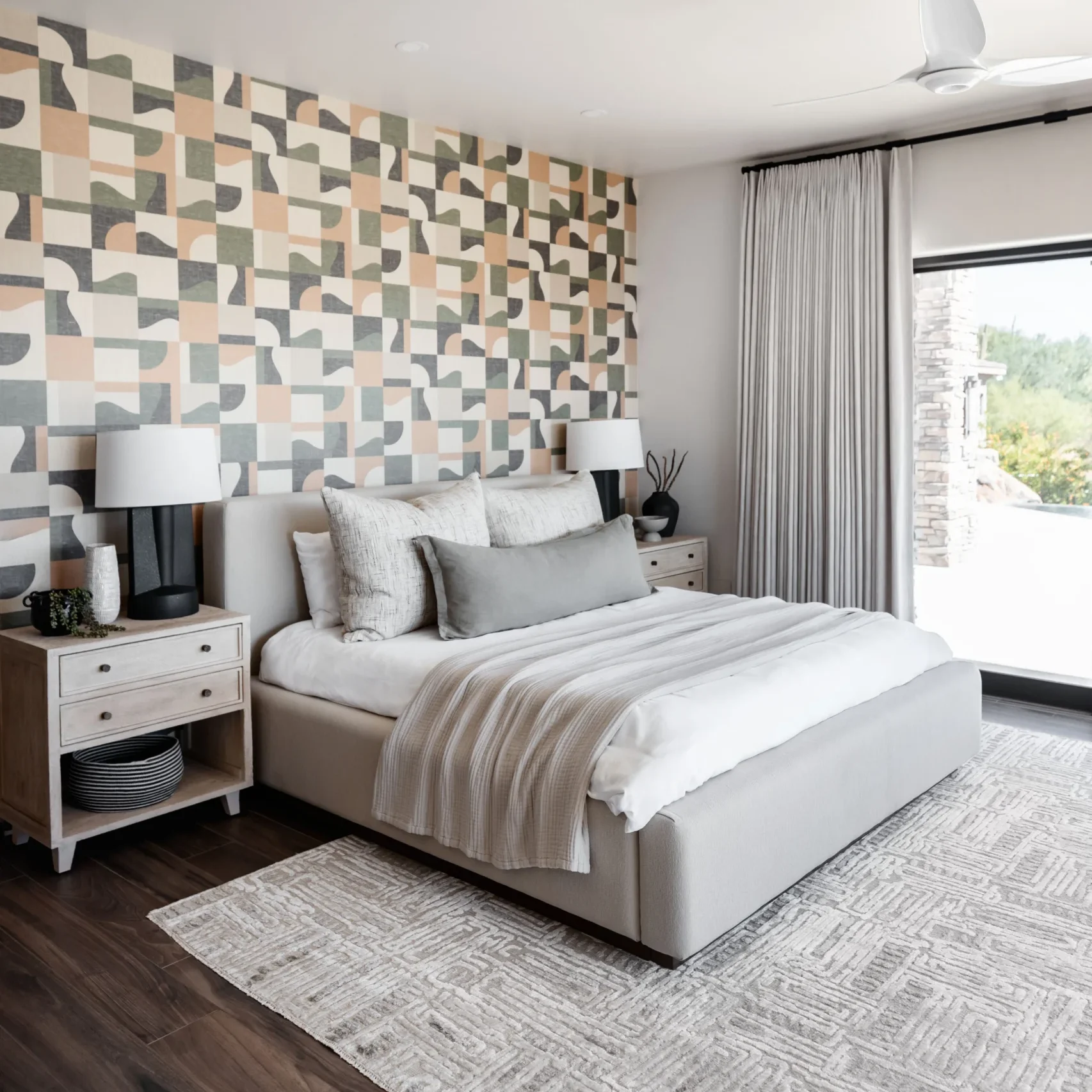A bedroom with cream bedding and modern wallpaper in Tuscon