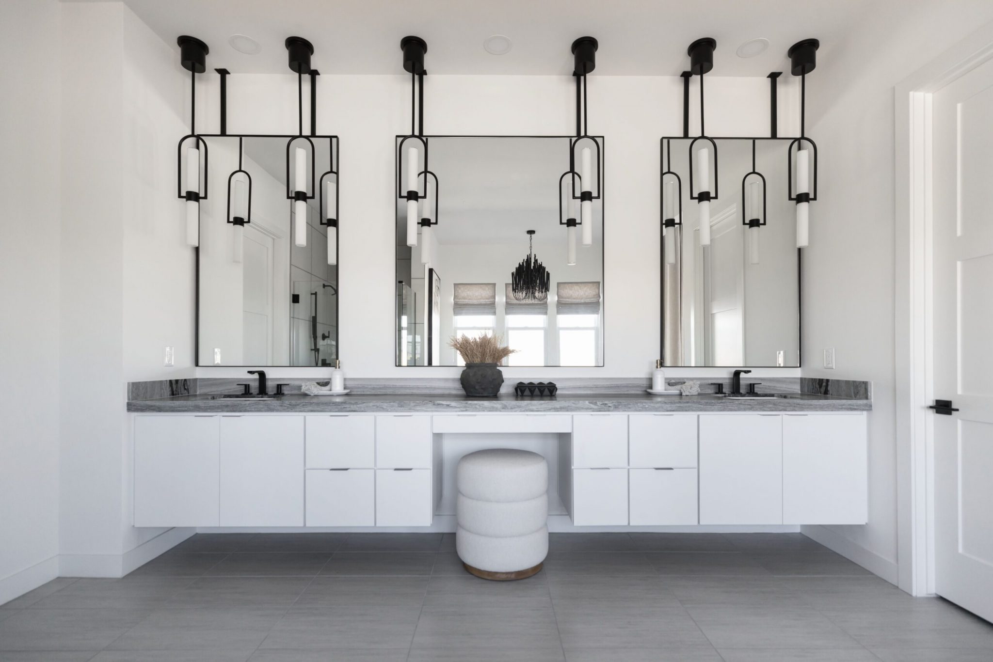 A newly remodeled bathroom sink with modern lighting fixtures in Flagstaff