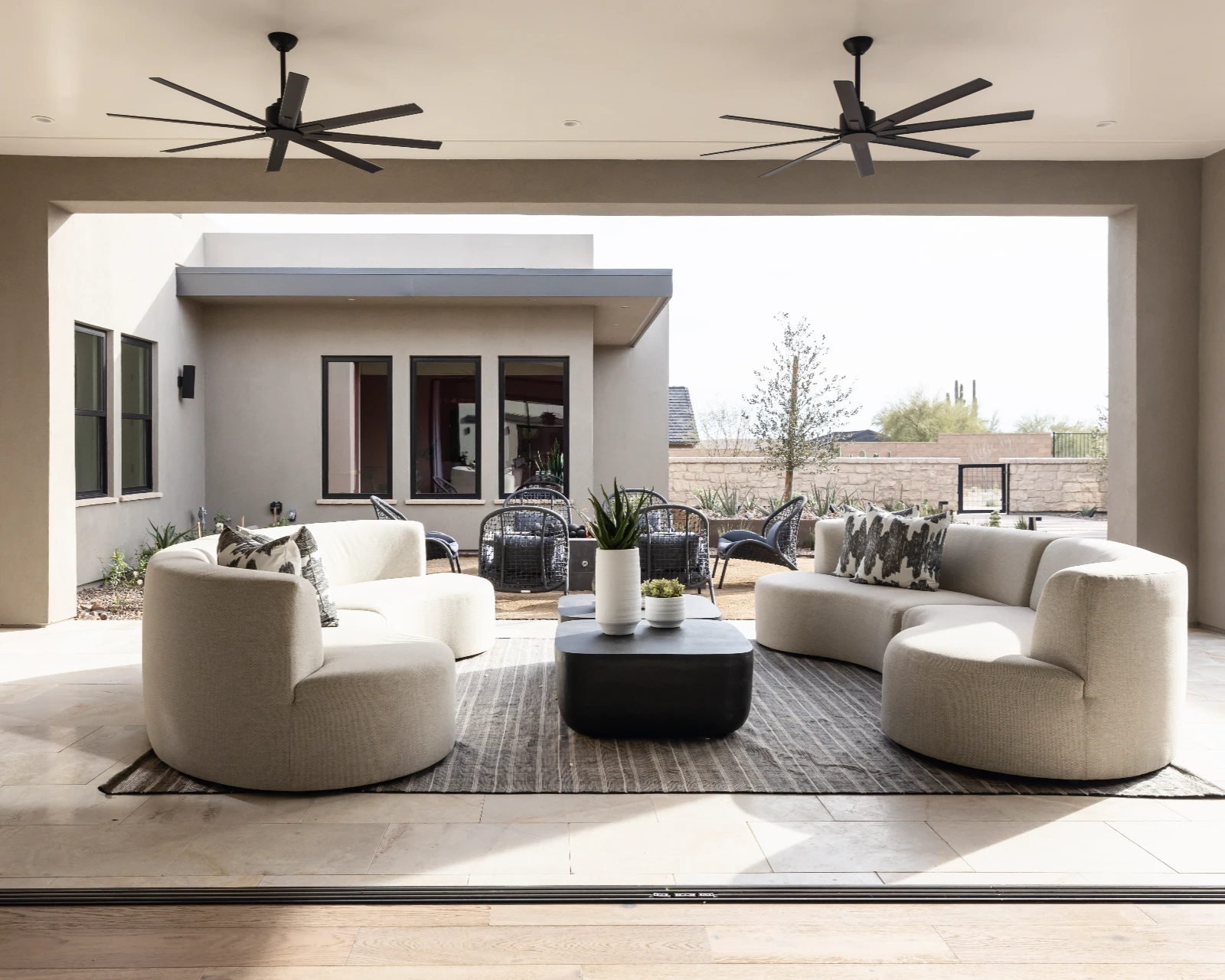 Patio with ceiling fans and outdoor furnishings